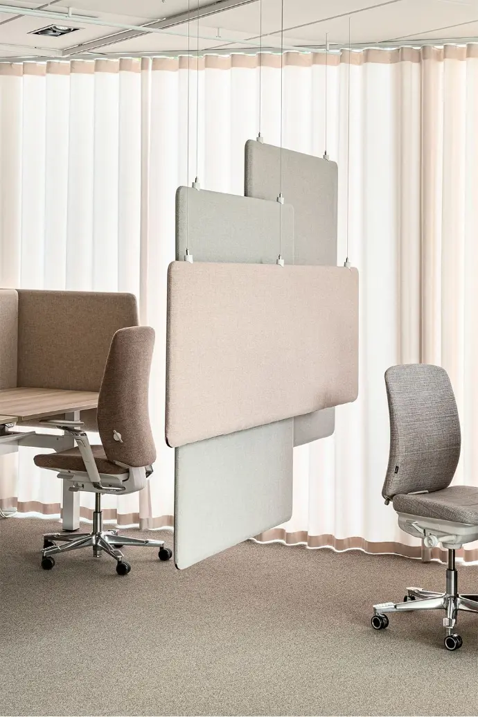 Purple acoustic fabric divider creating private workspace