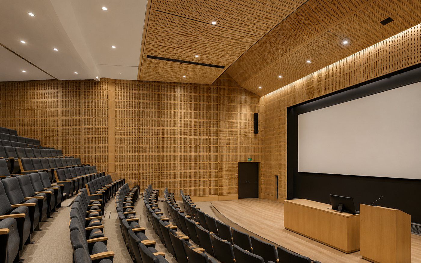 Slotted wood acoustic panels installed in a auditorium / lecture hall — Yamamah Smart