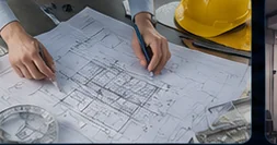 Site survey — engineer reviewing acoustic project blueprints