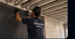 Installation — Yamamah Smart team installing acoustic wall panels