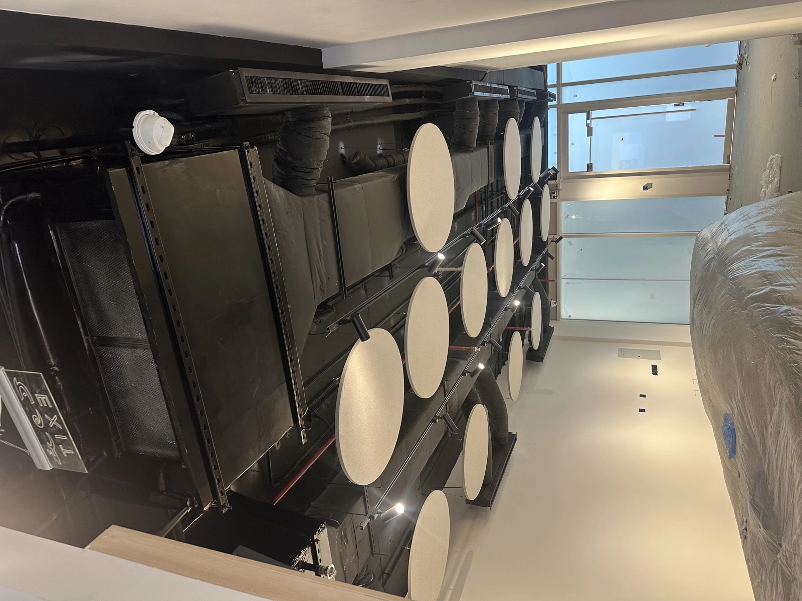 HungerStation HQ — open-plan baffles installation perspective